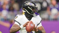 Baltimore Ravens quarterback Lamar Jackson (8) passes against the Minnesota Vikings in the first quarter at U.S. Bank Stadium.