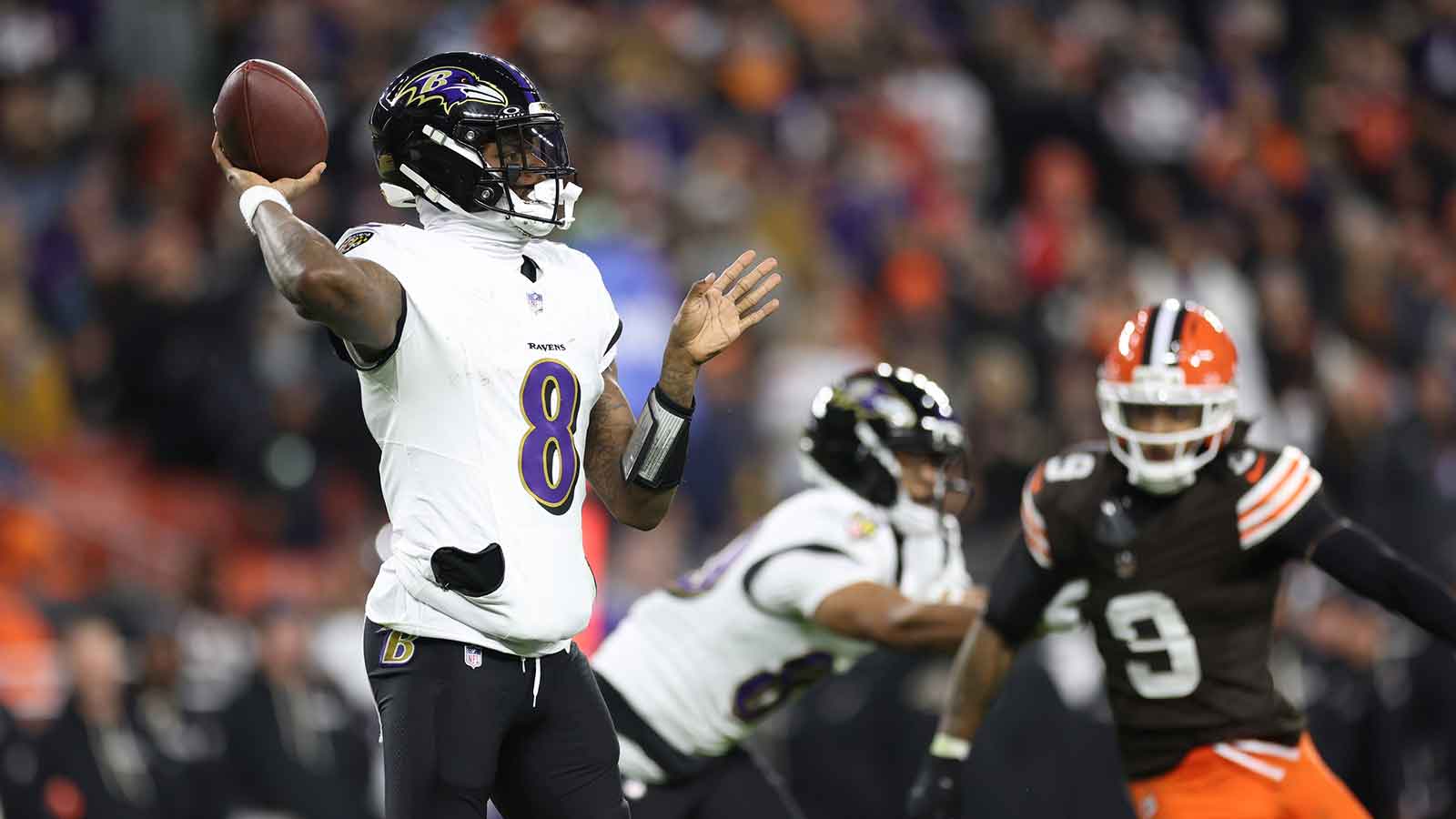 Baltimore Ravens quarterback Lamar Jackson (8) throws downfield during the second quarter against the Cleveland Browns at Huntington Bank Field.