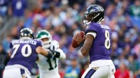 Baltimore Ravens quarterback Lamar Jackson (8) looks to pass during the fourth quarter against the New York Jets at M&T Bank Stadium.