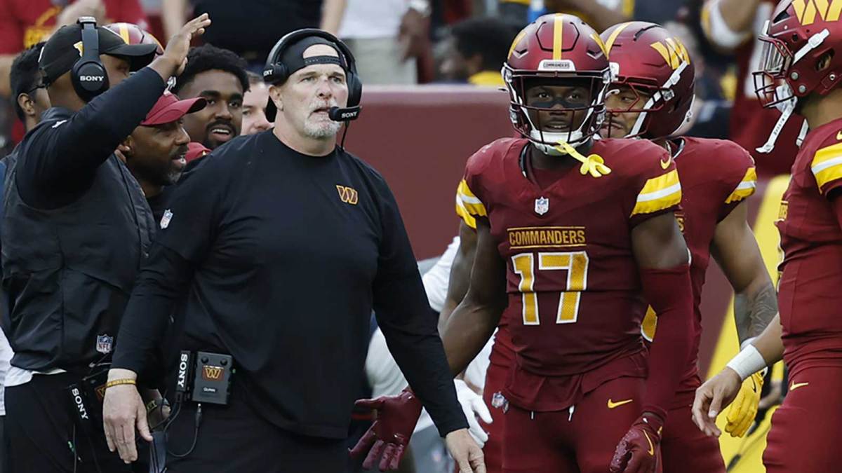 Washington Commanders head coach Dan Quinn (L) stands with Commanders wide receiver Terry McLaurin (17) on the sidelines against the Las Vegas Raiders during the third quarter at Northwest Stadium.