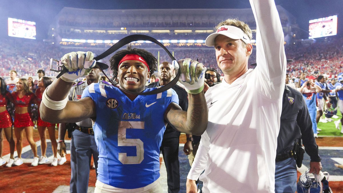Mississippi Rebels running back Kewan Lacy (5) and head coach Lane Kiffin react after defeating the Florida Gators at Vaught-Hemingway Stadium.