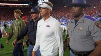 Mississippi Rebels head coach Lane Kiffin walks onto the field after defeating the Florida Gators at Vaught-Hemingway Stadium. Mandatory Credit: Petre Thomas-Imagn Images