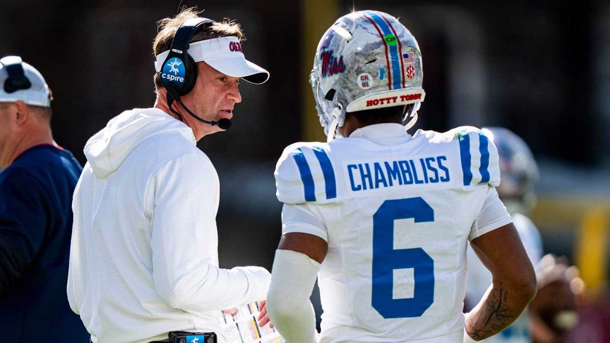 Ole Miss head coach Lane Kiffin talks with quarterback Trinidad Chambliss (6) during a college football game between Mississippi State and Ole Miss at Davis Wade Stadium in Starkville, Miss., on Friday, Nov. 28, 2025. Ole Miss defeated Mississippi State 38-19 in the Egg Bowl.