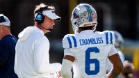 Ole Miss head coach Lane Kiffin talks with quarterback Trinidad Chambliss (6) during a college football game between Mississippi State and Ole Miss at Davis Wade Stadium in Starkville, Miss., on Friday, Nov. 28, 2025. Ole Miss defeated Mississippi State 38-19 in the Egg Bowl.
