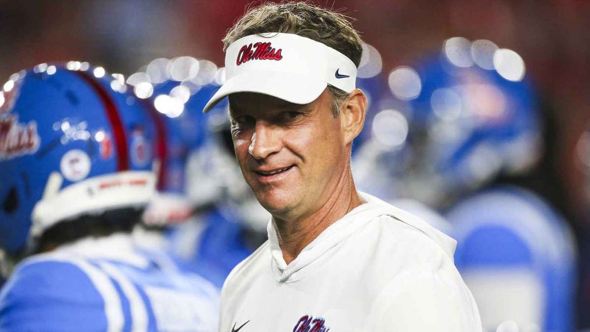 Mississippi Rebels head coach Lane Kiffin watches pregame warmups against the Florida Gators at Vaught-Hemingway Stadium.
