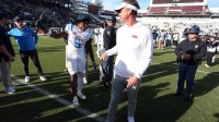 Mississippi Rebels running back Kewan Lacy (5) and head coach Lane Kiffin celebrate after defeating against the Mississippi State Bulldogs at Davis Wade Stadium at Scott Field