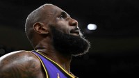 Los Angeles Lakers forward LeBron James (23) looks into the crowd during a timeout in the fourth quarter of a game against the Boston Celtics at the TD Garden.