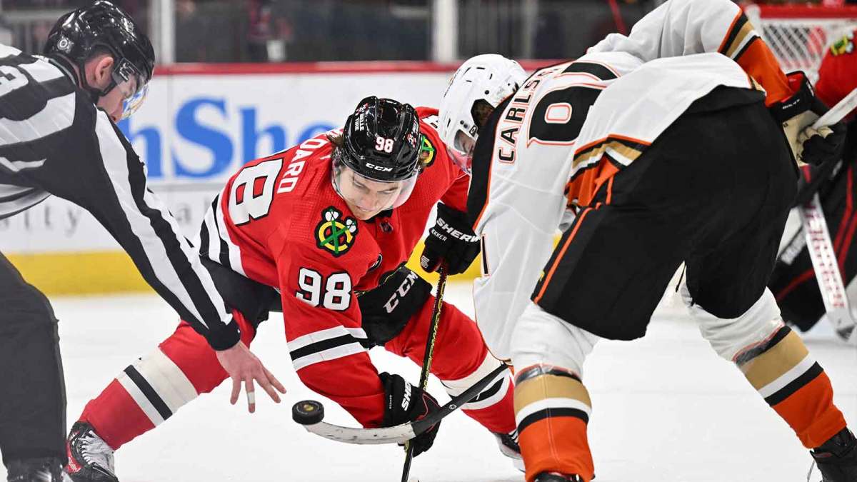 Chicago Blackhawks forward Connor Bedard (98) takes a face off against Anaheim Ducks forward Leo Carlsson (91) in the second period at United Center.