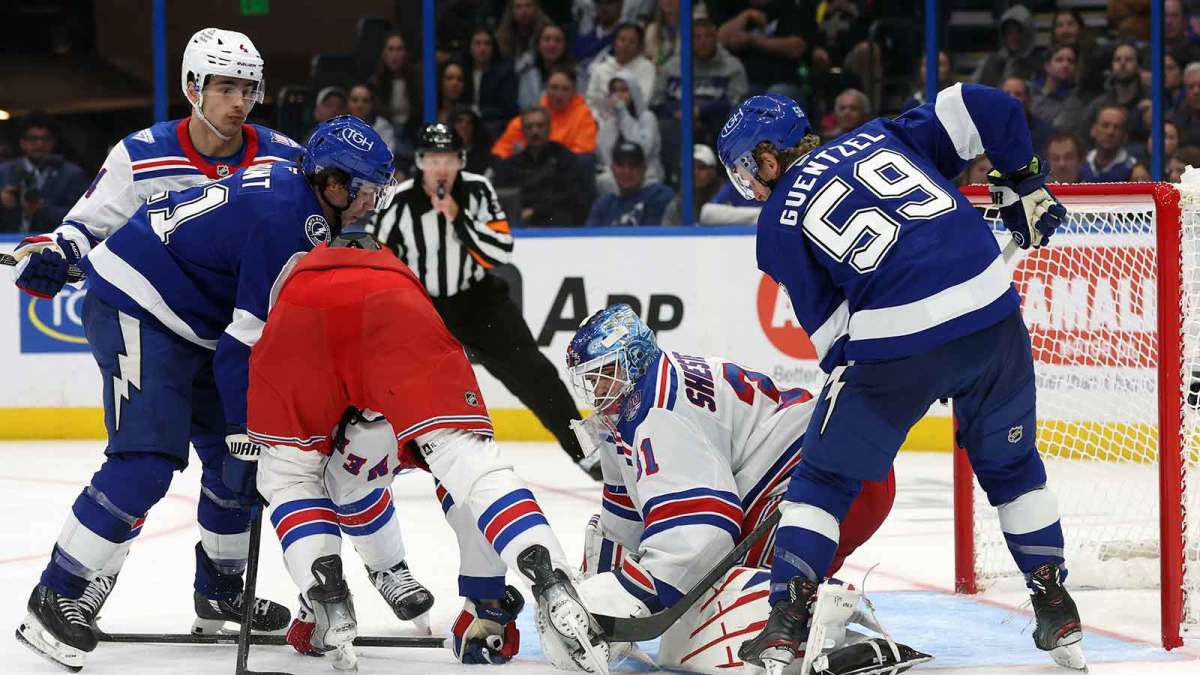 New York Rangers goaltender Igor Shesterkin (31) defends the puck from Tampa Bay Lightning center Jake Guentzel (59) and enter Brayden Point (21) during the third period at Benchmark International Arena.