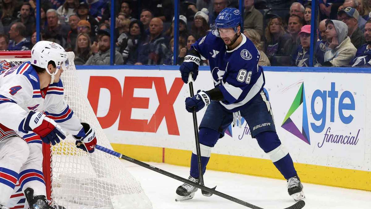 Tampa Bay Lightning right wing Nikita Kucherov (86) skates with the puck as New York Rangers defenseman Braden Schneider (4) defends during the third period at Benchmark International Arena.