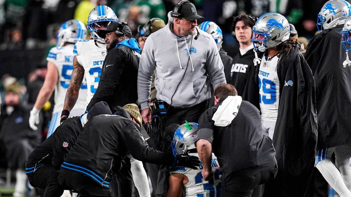 Detroit Lions head coach Dan Campbell checks on safety Brian Branch (32) due to an injury during the second half against Philadelphia Eagles at Lincoln Financial Field in Philadelphia on Sunday, November 16, 2025.