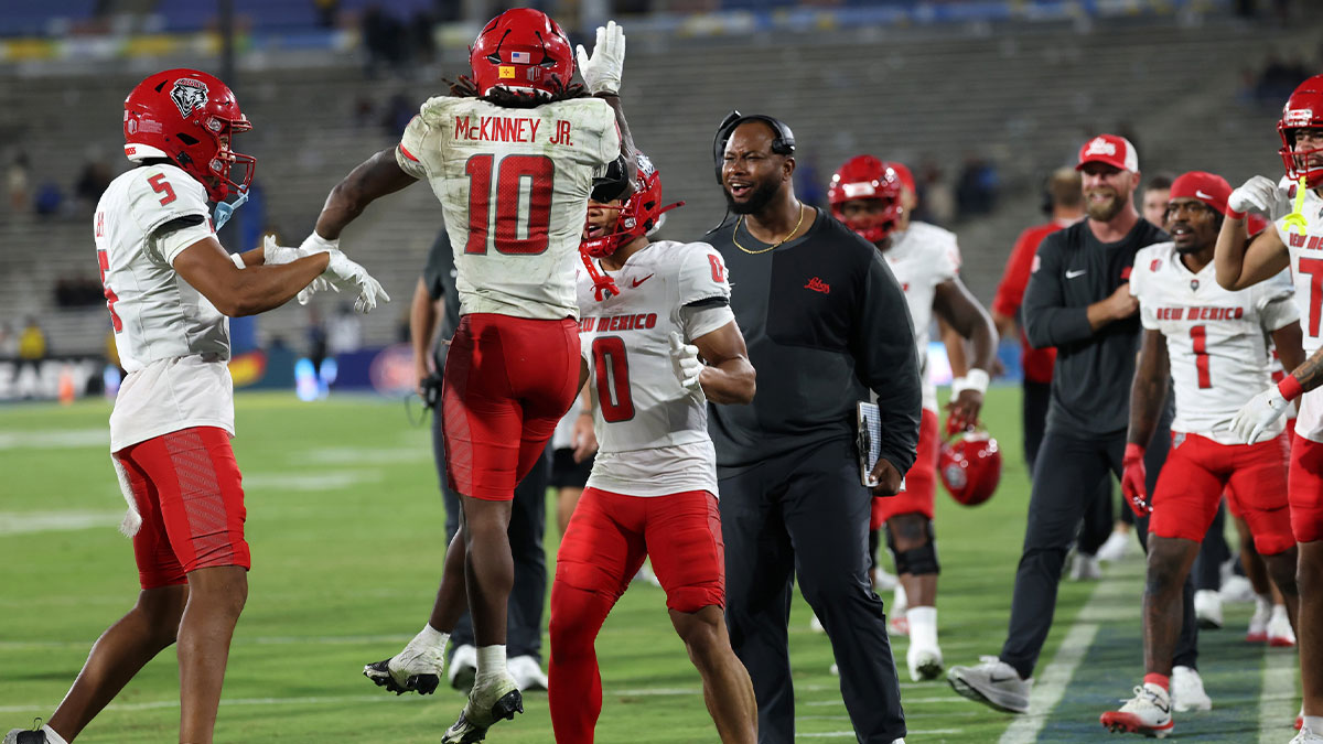 New Mexico Lobos running back D.J. McKinney (10) celebrates with wide receiver Zhaiel Smith (0) after scoring a touchdown during the fourth quarter against the UCLA Bruins at Rose Bowl.