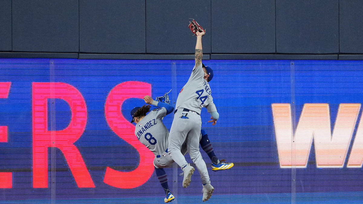 Los Angeles Dodgers center fielder Andy Pages (44) makes a catch against the Toronto Blue Jays in the ninth inning for game seven of the 2025 MLB World Series at Rogers Centre. Mandatory Credit: Nick Turchiaro-Imagn Images