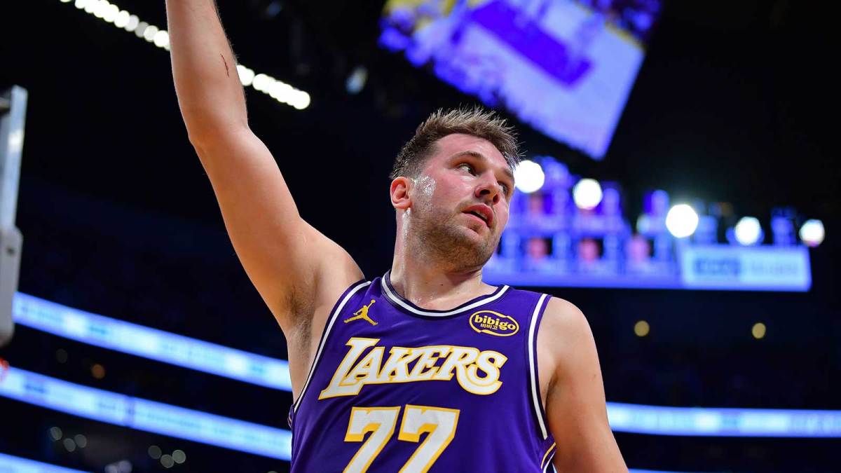 Los Angeles Lakers guard Luka Doncic (77) reacts after scoring the basket and drawing the foul against the San Antonio Spurs during the first half at Crypto.com Arena.