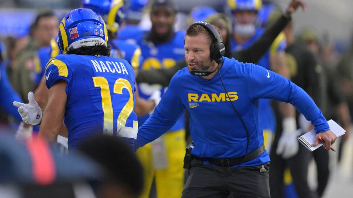 Los Angeles Rams head coach Sean McVay and wide receiver Puka Nacua (12) react after a touchdown against the New Orleans Saints during the first half at SoFi Stadium.