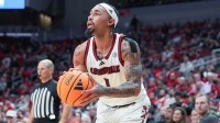 Louisville Cardinals guard J'Vonne Hadley (1) sets up to take a three-point shot during the Cards' final exhibition game before the start of the 2025-26 basketball season at the KFC Yum! Center in Louisville, Kentucky.
