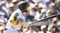 San Diego Padres first baseman Luis Arraez (4) hits a single during the first inning against the Milwaukee Brewers at Petco Park.
