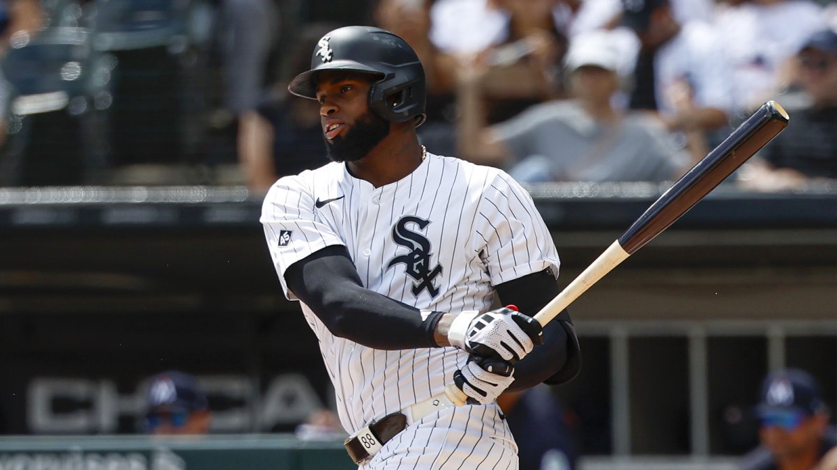 Chicago White Sox center fielder Luis Robert Jr. (88) singles against the Minnesota Twins during the first inning at Rate Field.