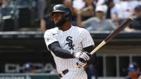 Chicago White Sox center fielder Luis Robert Jr. (88) singles against the Minnesota Twins during the first inning at Rate Field.