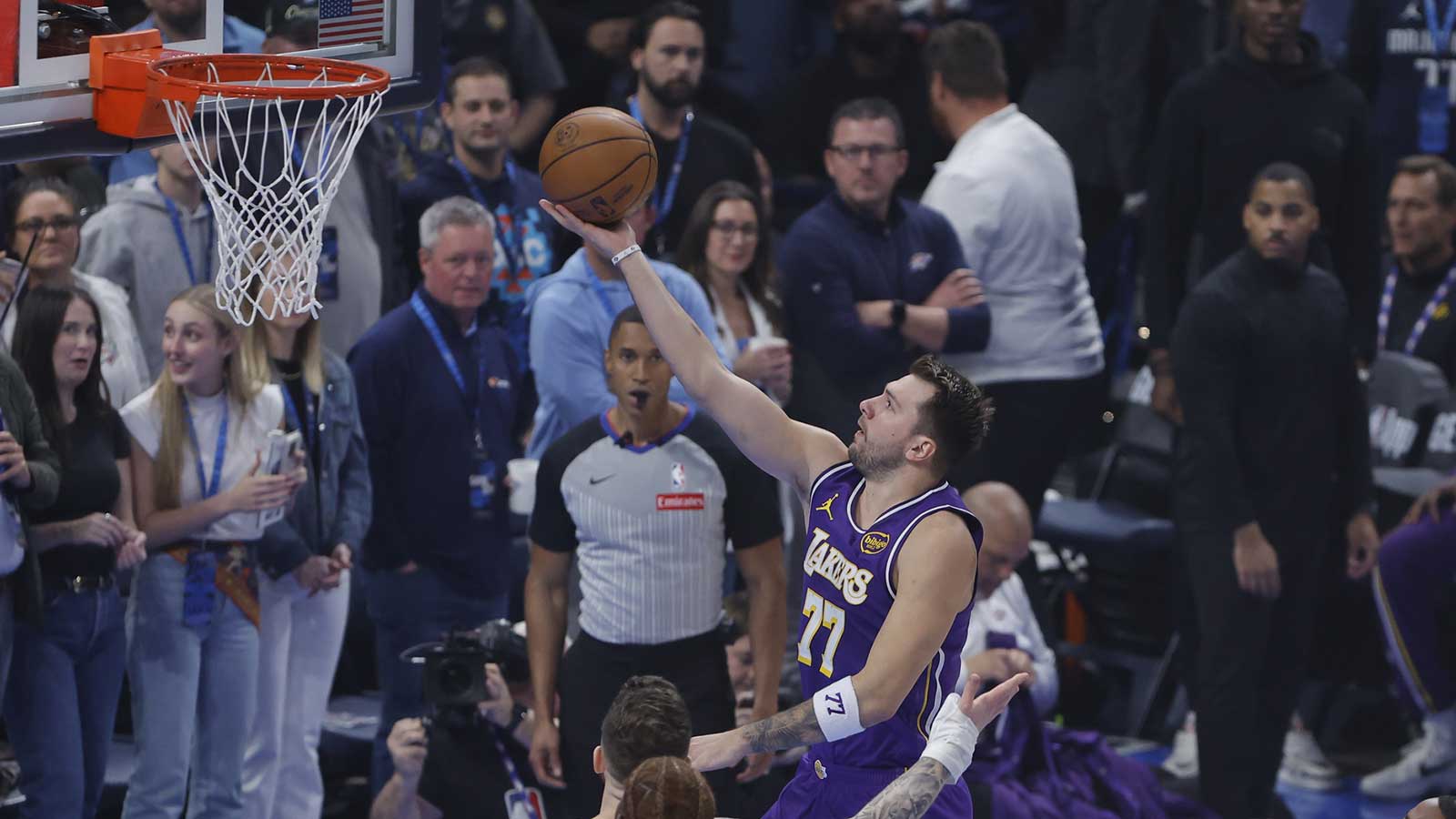 Los Angeles Lakers guard Luka Doncic (77) goes up for a basket against the Oklahoma City Thunder during the first quarter at Paycom Center. 