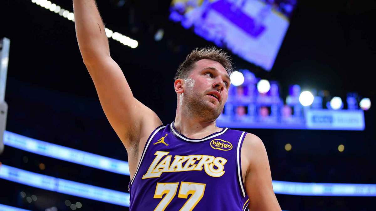 os Angeles Lakers guard Luka Doncic (77) reacts after scoring the basket and drawing the foul against the San Antonio Spurs during the first half at Crypto.com Arena.