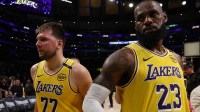 Los Angeles Lakers guard Luka Doncic (77) and Los Angeles Lakers forward LeBron James (23) leave a court after defeating the Minnesota Timberwolves 94-85 in game two of first round for the 2024 NBA Playoffs at Crypto.com Arena.