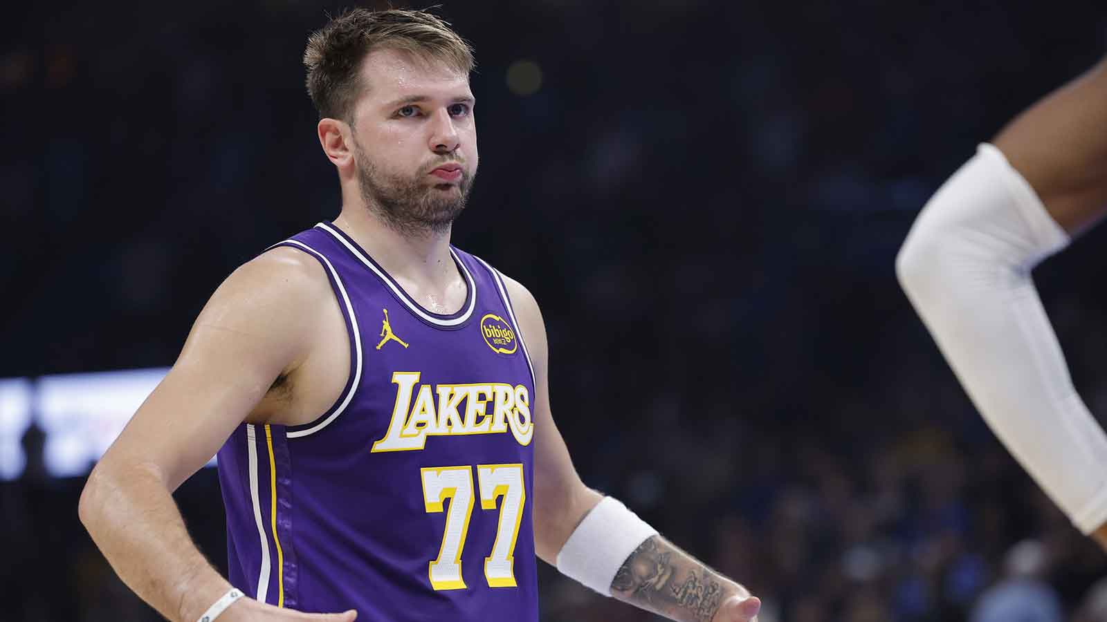 Los Angeles Lakers guard Luka Doncic reacts to a fan during the second quarter of a game against the Oklahoma City Thunder at Paycom Center