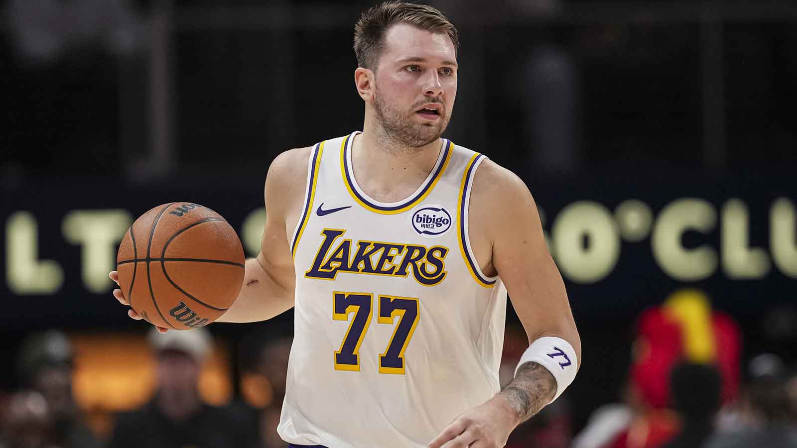 Los Angeles Lakers guard Luka Doncic (77) controls the ball against the Atlanta Hawks during the first half at State Farm Arena.