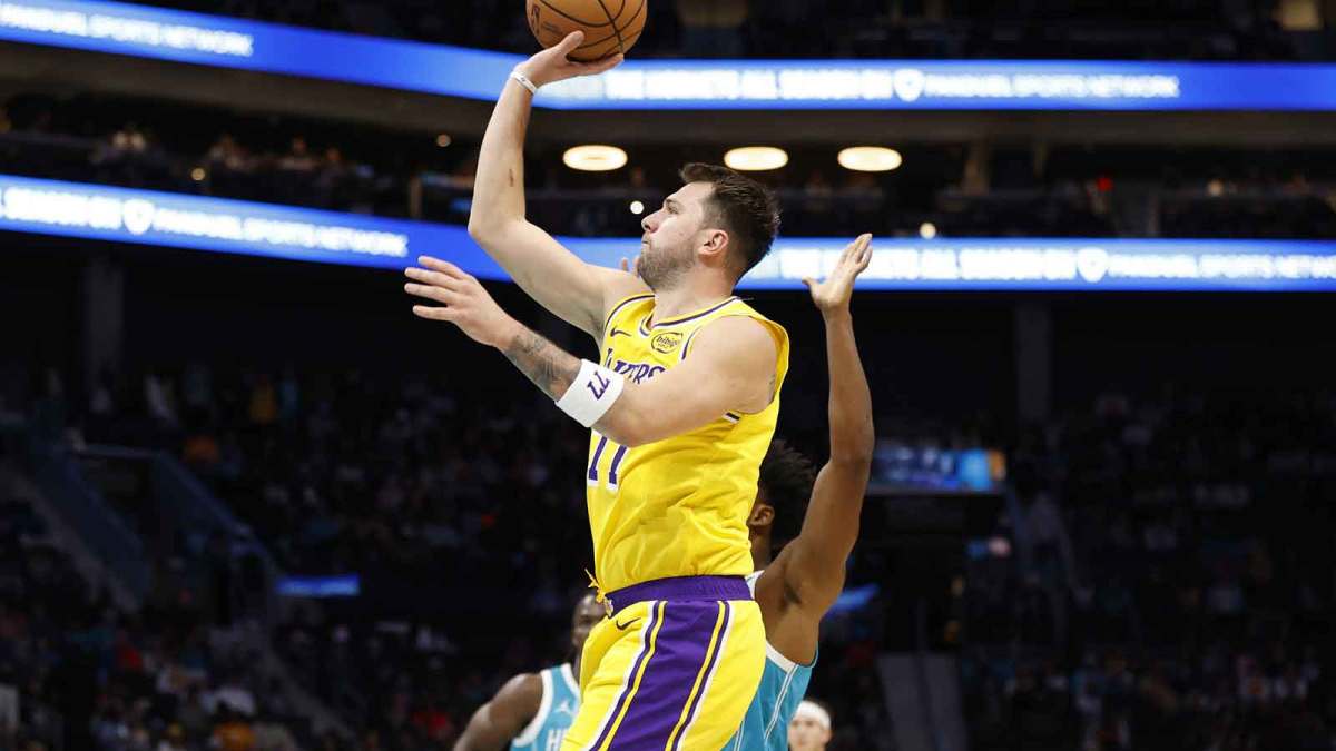 Los Angeles Lakers forward/guard Luka Doncic (77) floats a shot towards the basket during the first quarter against the Charlotte Hornets at Spectrum Center.