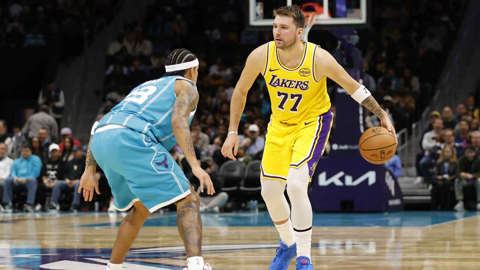 Los Angeles Lakers forward/guard Luka Doncic (77) is guarded by Charlotte Hornets guard Tre Mann (23) during the second quarter at Spectrum Center.