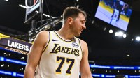 Los Angeles Lakers guard Luka Doncic (77) on the sidelines during the game against the Miami Heat during the second half at Crypto.com Arena.
