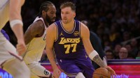 Los Angeles Lakers guard Luka Doncic (77) drives past Los Angeles Clippers forward Kawhi Leonard (2) during the first half at Crypto.com Arena.