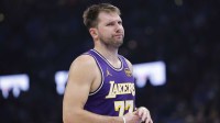 Los Angeles Lakers guard Luka Doncic reacts to a fan during the second quarter of a game against the Oklahoma City Thunder at Paycom Center.