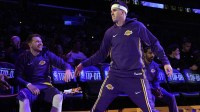 Los Angeles Lakers guard Luka Doncic (left) and guard Austin Reaves (15) interact before the game against the Minnesota Timberwolves at Crypto.com Arena.