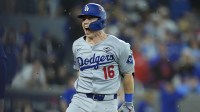 Los Angeles Dodgers catcher Will Smith (16) celebrates after hitting a home run against the Toronto Blue Jays in the eleventh inning during game seven of the 2025 MLB World Series at Rogers Centre.