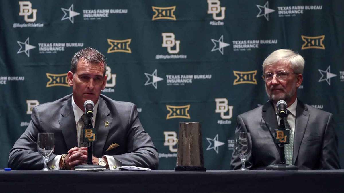 Baylor Bears interim president David E. Garland (right) and new athletic director Mack Rhoades (left) speak at a press conference during the Big 12 Media Days at Omni Dallas Hotel.