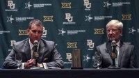 Baylor Bears interim president David E. Garland (right) and new athletic director Mack Rhoades (left) speak at a press conference during the Big 12 Media Days at Omni Dallas Hotel.