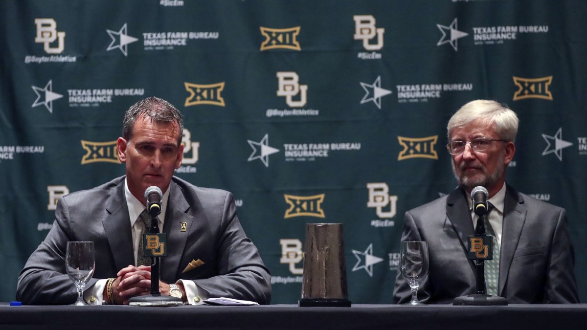 Baylor Bears interim president David E. Garland (right) and new athletic director Mack Rhoades (left) speak at a press conference during the Big 12 Media Days at Omni Dallas Hotel. Mandatory Credit: Kevin Jairaj-Imagn Images