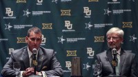 Baylor Bears interim president David E. Garland (right) and new athletic director Mack Rhoades (left) speak at a press conference during the Big 12 Media Days at Omni Dallas Hotel.