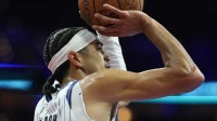 Orlando Magic guard Anthony Black (0) shoots the ball against the Philadelphia 76ers during the second quarter at Xfinity Mobile Arena.
