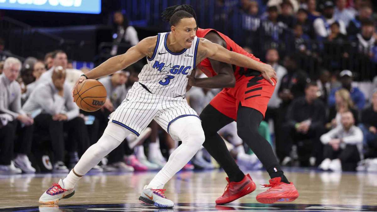 Orlando Magic guard Desmond Bane (3) is guarded baby Portland Trail Blazers guard Sidy Cissoko (91) in the second quarter at Kia Center.