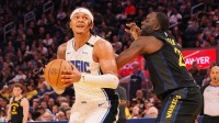 Orlando Magic forward Paolo Banchero (5) looks to the basket against Golden State Warriors forward Draymond Green (23) during the second quarter at Chase Center.
