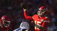 Kansas City Chiefs quarterback Patrick Mahomes (15) throws a pass against Indianapolis Colts defensive end Laiatu Latu (97) in the first half at GEHA Field at Arrowhead Stadium.