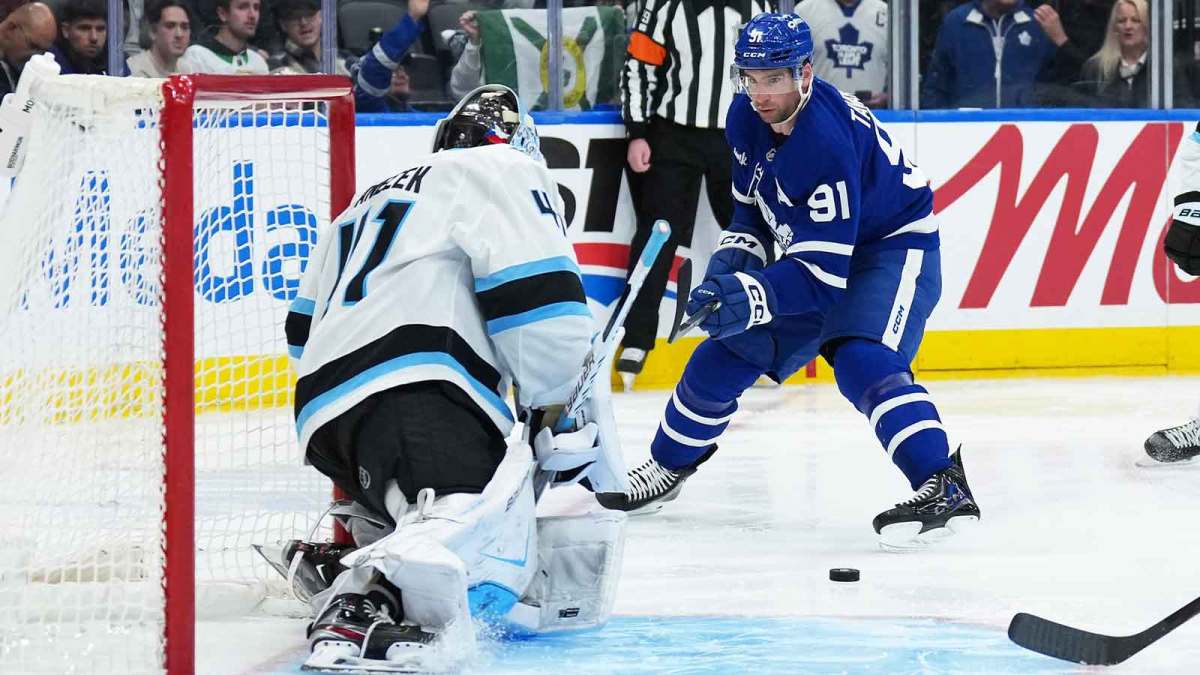 Toronto Maple Leafs center John Tavares (91) skates with the puck on net against the Utah Mammoth during the third period at Scotiabank Arena.