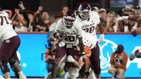 Texas A&M Aggies quarterback Marcel Reed (10) keeps the ball for yards during the first half against the Texas Longhorns at Darrell K Royal-Texas Memorial Stadium.