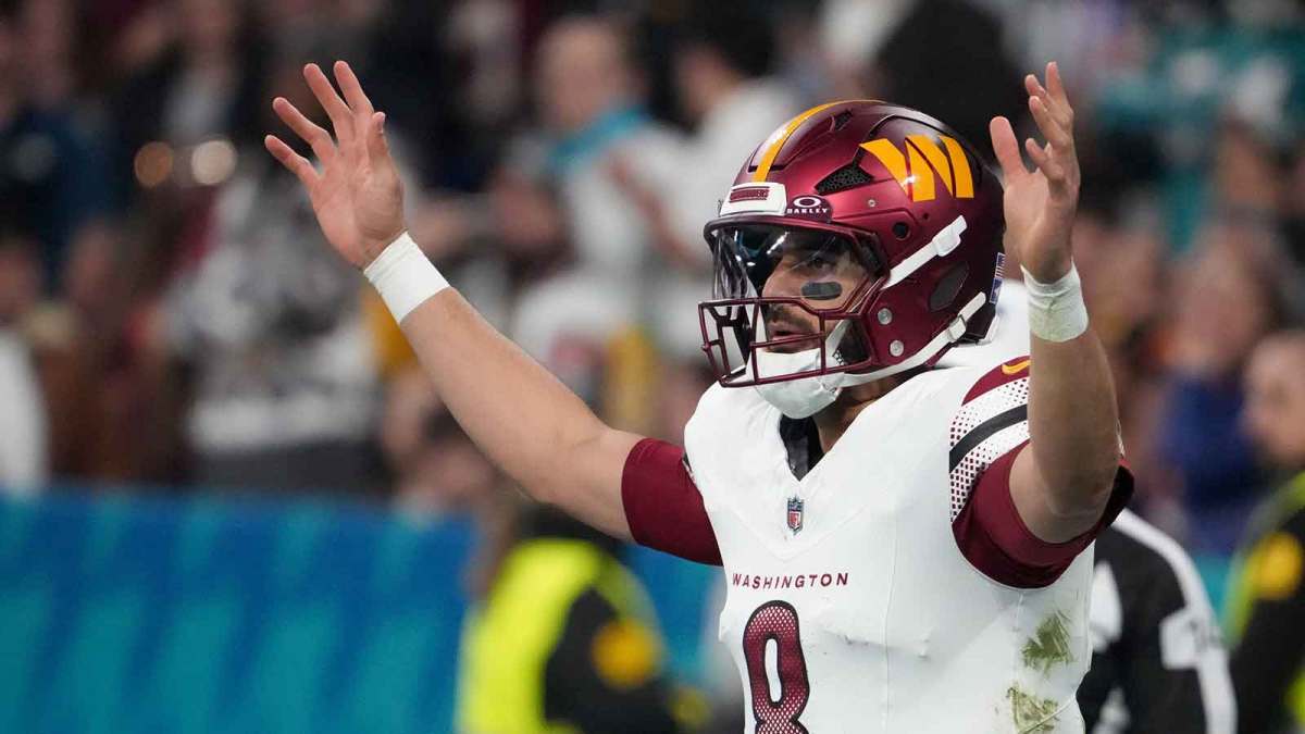 Washington Commanders quarterback Marcus Mariota (8) reacts after a play against the Miami Dolphins in the third quarter during the 2025 NFL Madrid Game at Santiago Bernabeu Stadium. Mandatory Credit: Kirby Lee-Imagn Images