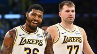 Los Angeles Lakers guard Marcus Smart (36) reacts with Los Angeles Lakers guard Luka Doncic (77) during a time out against the Miami Heat during the second half at Crypto.com Arena.