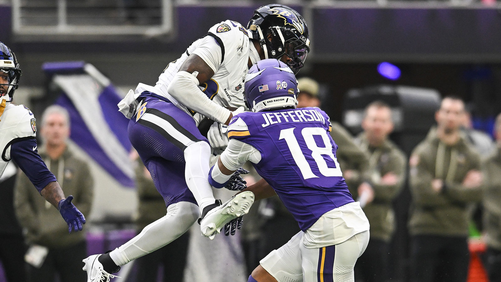 Baltimore Ravens cornerback Marlon Humphrey (44) makes an interception as Minnesota Vikings wide receiver Justin Jefferson (18) attempts to defend during the second quarter at U.S. Bank Stadium.