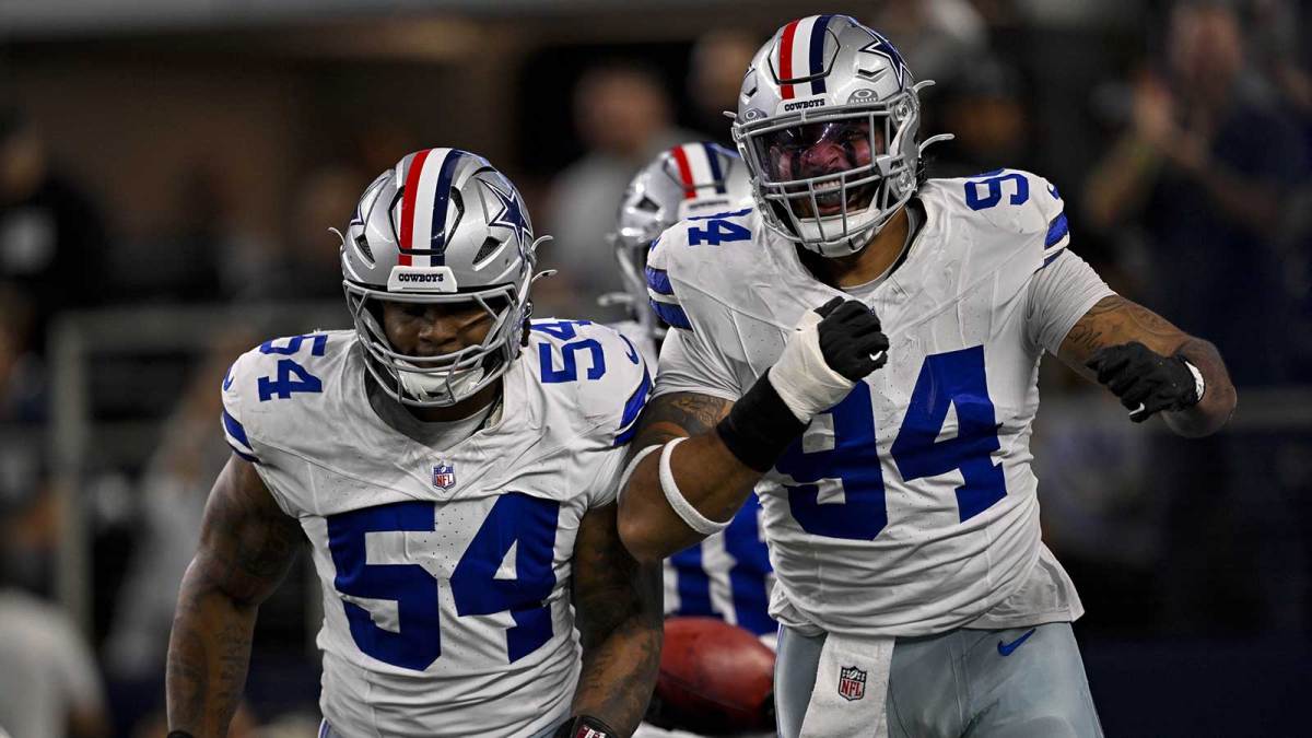 Dallas Cowboys defensive end Marshawn Kneeland (94) and defensive end Sam Williams (54) celebrates after returning a blocked punt for a touchdown during the game between the Dallas Cowboys and the Arizona Cardinals at AT&T Stadium.