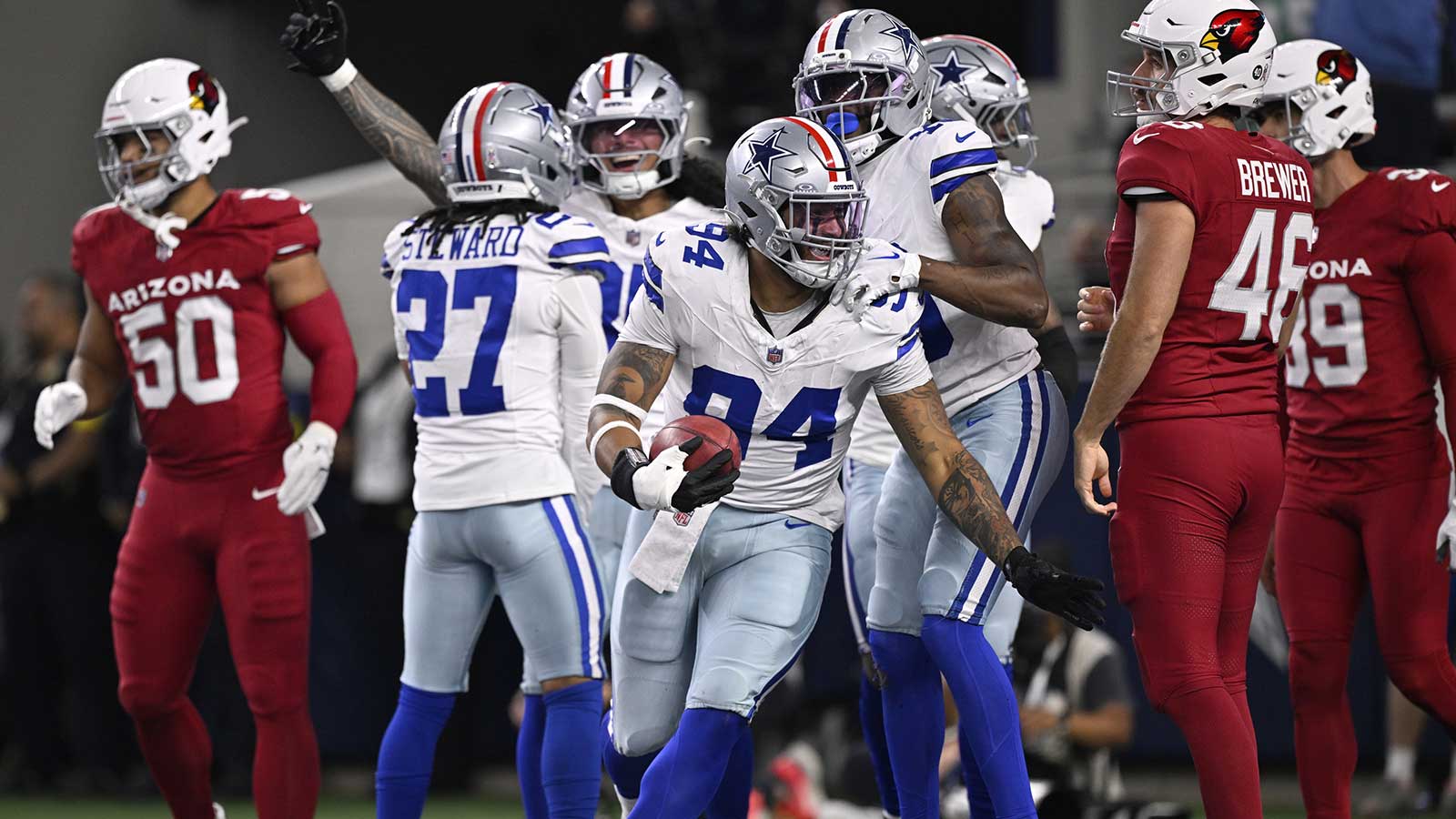Dallas Cowboys defensive end Marshawn Kneeland (94) celebrates after recovering a blocked punt for a touchdown against the Arizona Cardinals in the first half at AT&T Stadium. 
